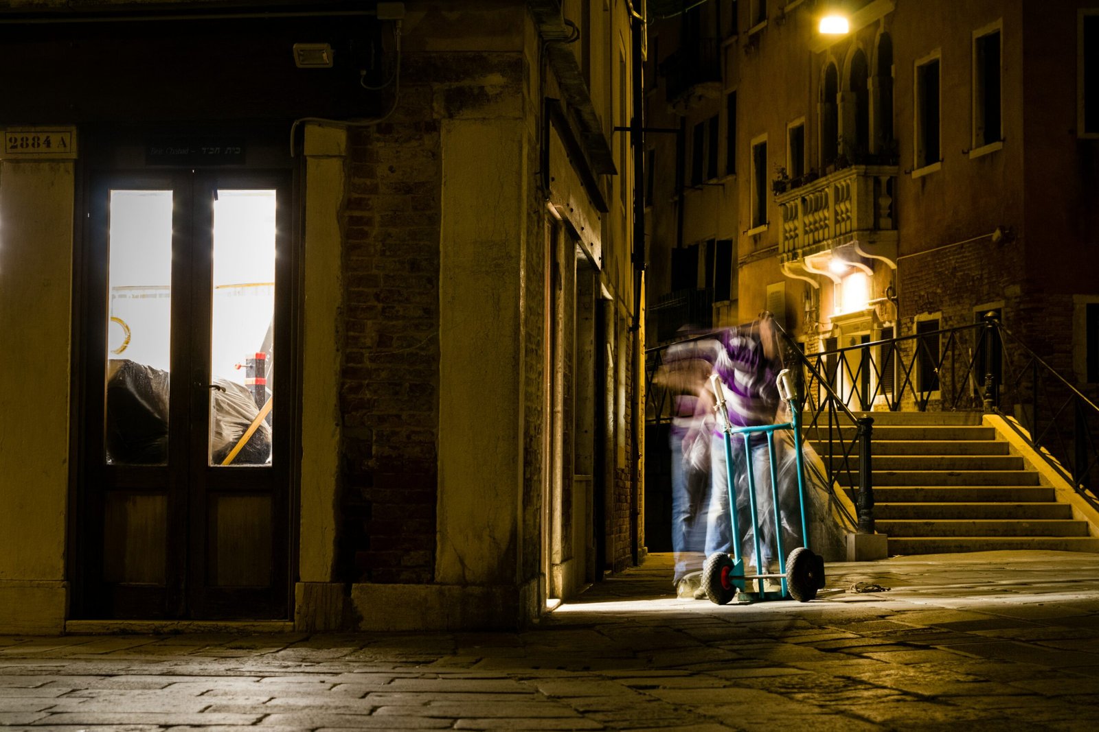 person beside store facade